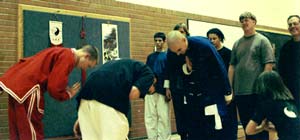 Buddha Zhen receives Patriarch Sash from disciples of Shaolin Chi Mantis